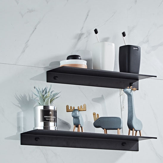 etagere de douche noire deux bibelots tailles differentes