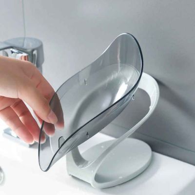 porte savon gris main retire bol