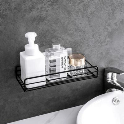 rangement dans la douche noir dessus lavabo